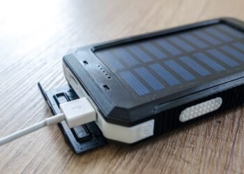 Black solar power bank with charging cable, a small way to store solar energy