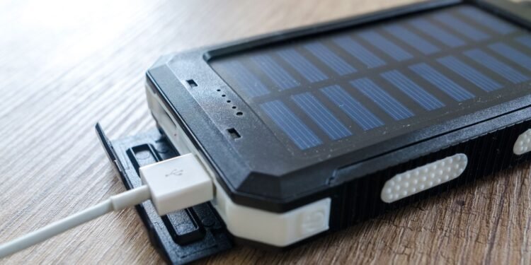 Black solar power bank with charging cable, a small way to store solar energy