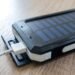 Black solar power bank with charging cable, a small way to store solar energy