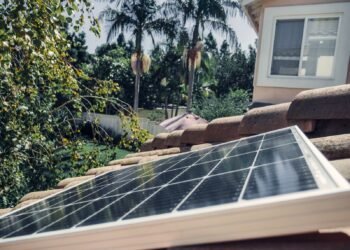 Close-up shot of a solar panel installed on a house roof