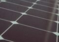 Close-up of photovoltaic cells and silver busbars that make up a solar panel