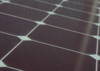 Close-up of photovoltaic cells and silver busbars that make up a solar panel