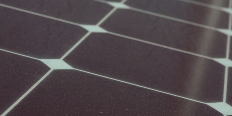 Close-up of photovoltaic cells and silver busbars that make up a solar panel