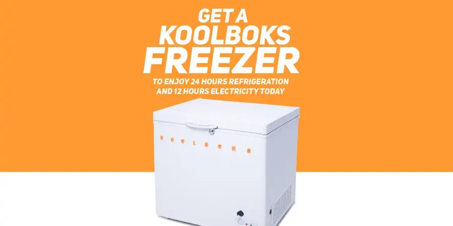 A Koolboks solar-powered freezer installed outdoors, operating independently off the grid with solar panels.