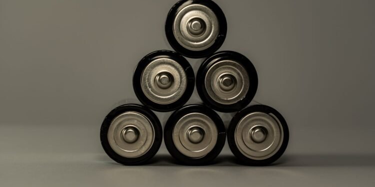 Cylindrical batteries arranged in a triangle shape on a flat surface