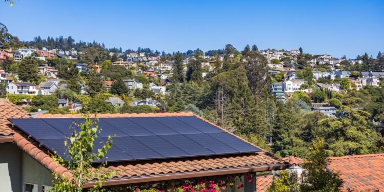 Suburban house with solar panels installed on its roof