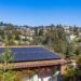 Suburban house with solar panels installed on its roof